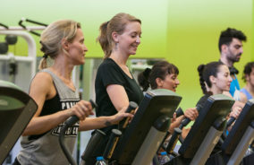 Group of women use the exercise machines at our Willesden gym